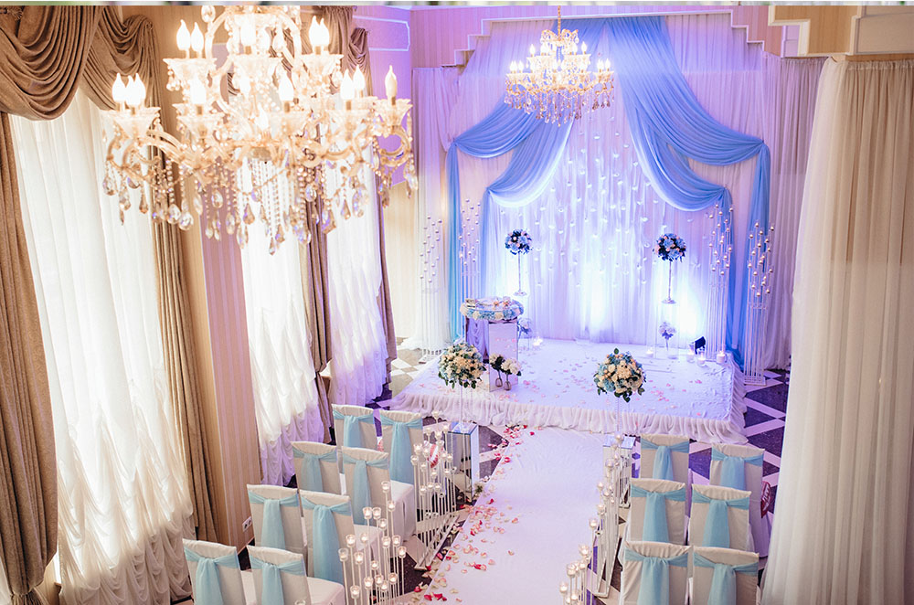 Indoor ceremony with flower petals on the aisle runner