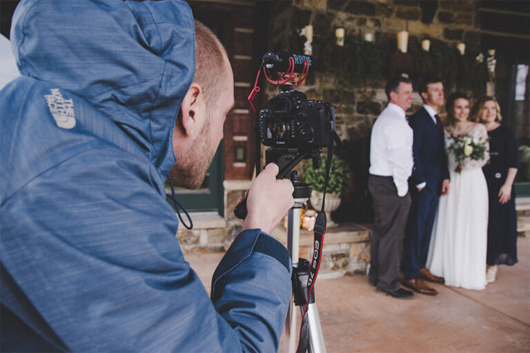 wedding videographer filming a wedding