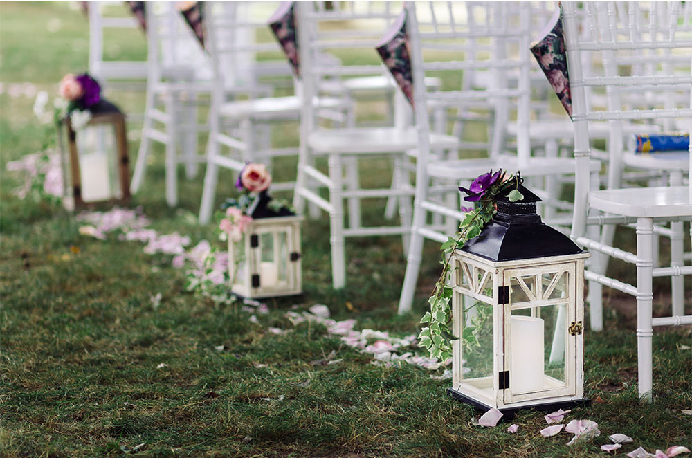 Rustic lanterns at an outdoor wedding ceremony