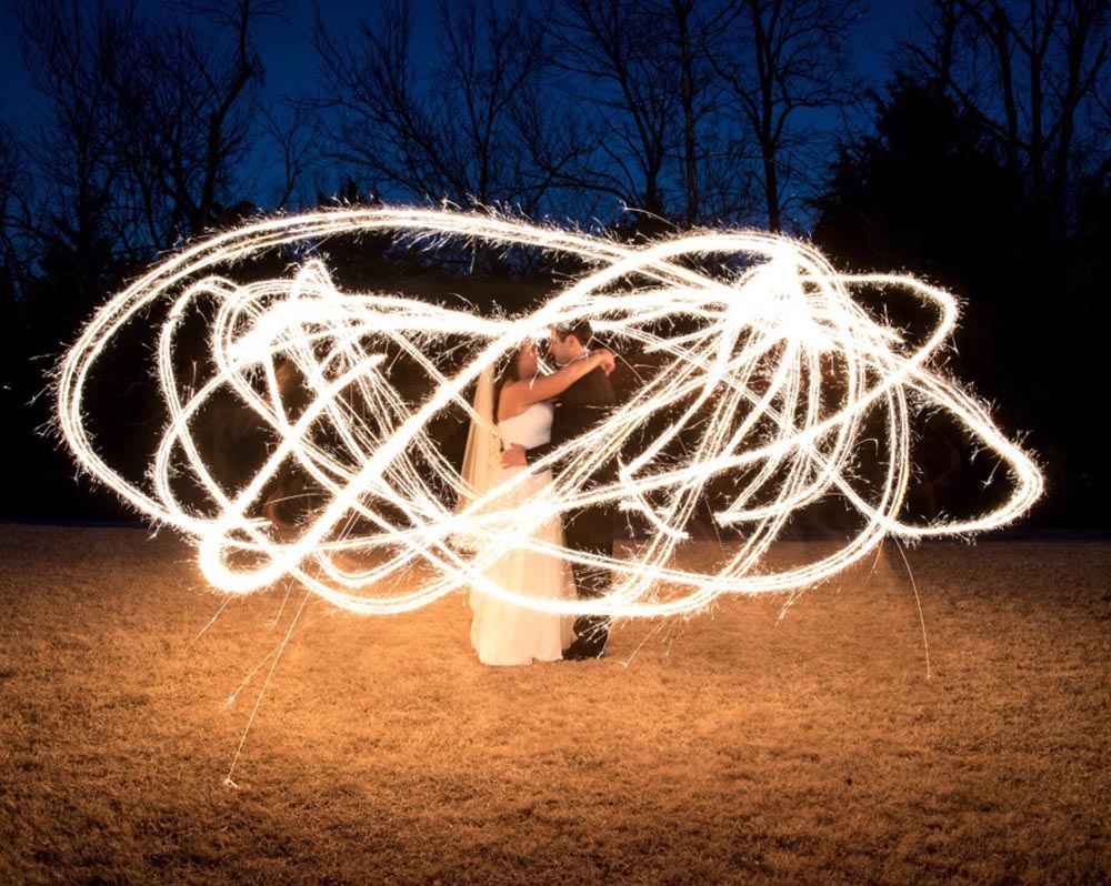 long exposure photography with bride and groom using sparklers