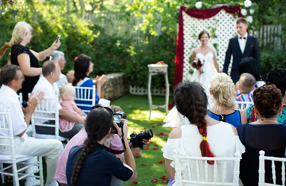 videographer and photographer at a wedding ceremony